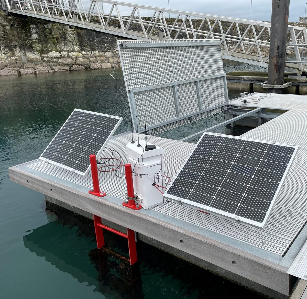 Solar-powered Ecodetect surface station with battery box in a harbour
